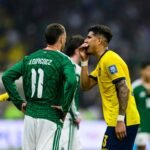 Hincapié covers his mouth during an argument with Giménez in the World Cup match between Mexico and Ecuador. Credit: Martín Fonseca/Eurasia Sport Images/Getty Images