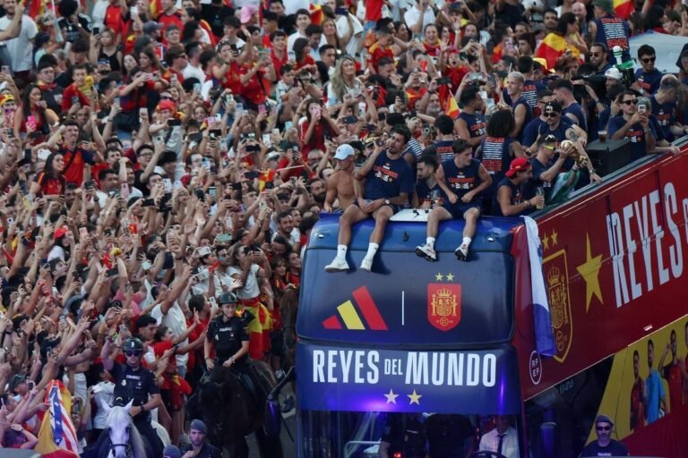 Spain national team players celebrate the World Cup title with fans in Madrid. Credit: Reuters