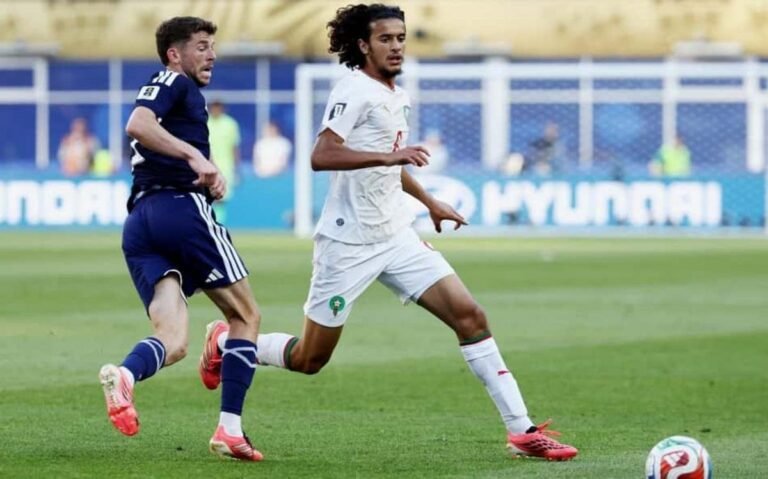 Moroccan Ayyoub Bouaddi chases the ball, marked by Scotland's Ryan Christie (Photo: Franck Fife/AFP)